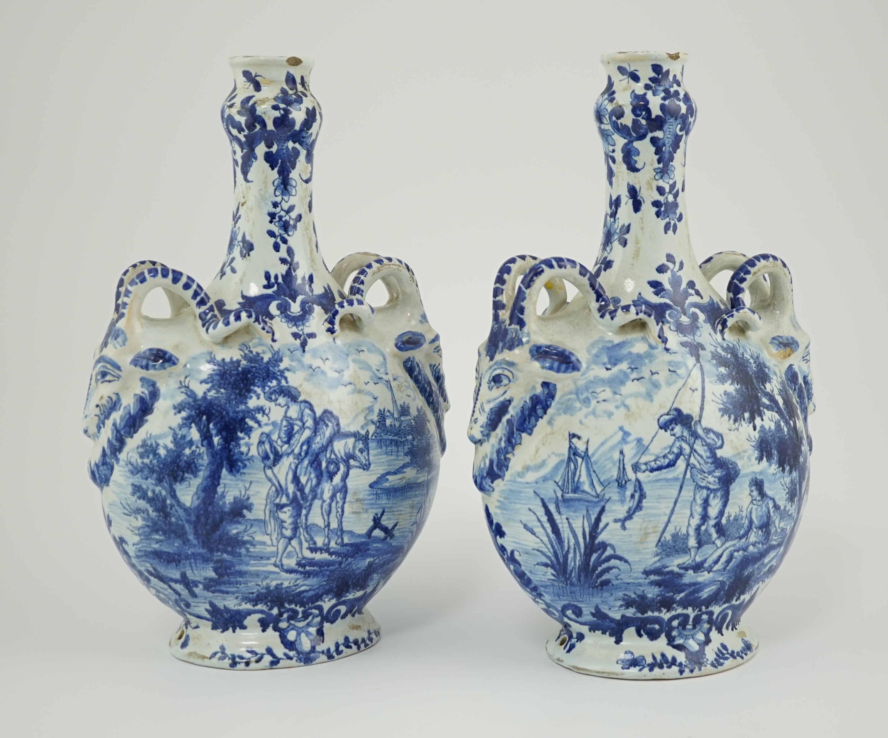 A pair of mid 18th century Delft blue and white flagons